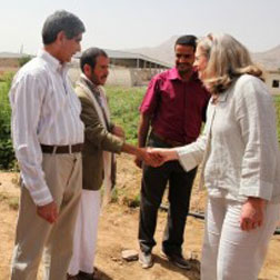 Acting AA Romanowski meets with a Yemeni farmer