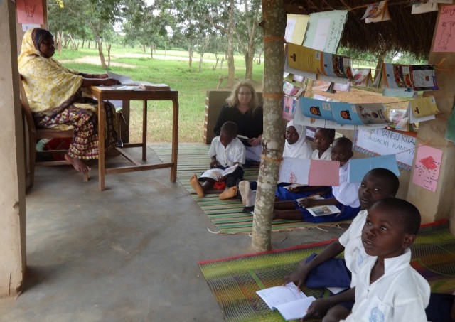 Anne reads with children at the Chaume Primary School in rural Mtwara.