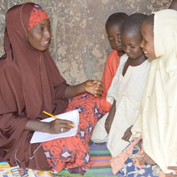 Nigerian children learning in classroom.