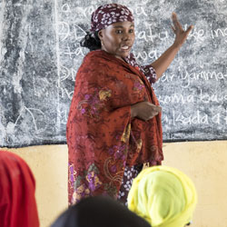 Nigerian female teacher in classroom.