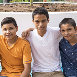 Boys in El Salvador sitting for a picture.