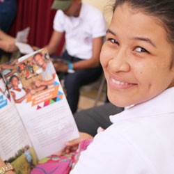 Nicaraguan teenage girl reading book.