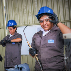 Nicaraguan girls learning to weld.