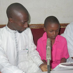 Isah Hussaini Nigerian child reads.
