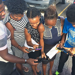 St. Lucian teenagers with cellular phones.