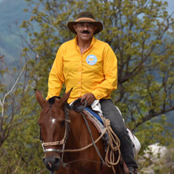 A nutrition worker on horseback.