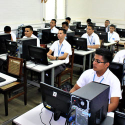 Students in class with computers.