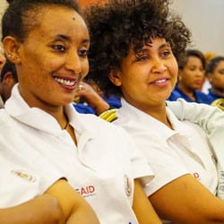 Two smiling women at a volunteer day event in Ethiopia