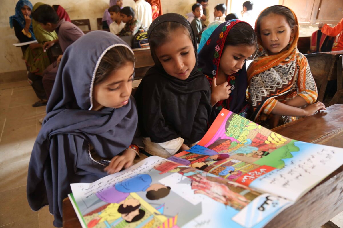 girls learning to read in Pakistan