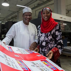 A Nigerian man and woman at a printing press