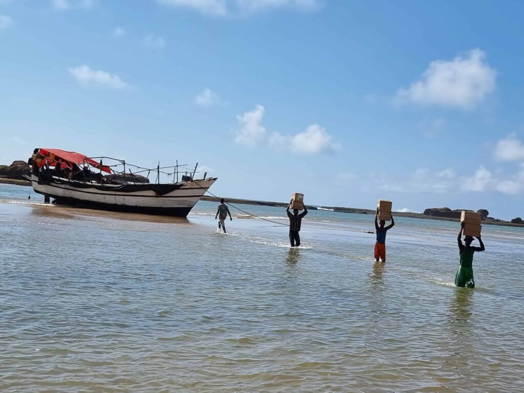 Books being offloaded from boats in Barawe